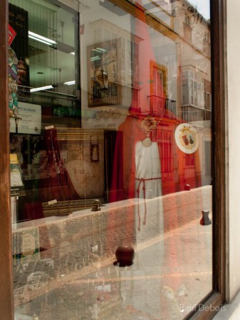 Religious shop, El Puerto de Santa Maria, Spain, with robes worn by Los Penitentes or penitents during Holy Week